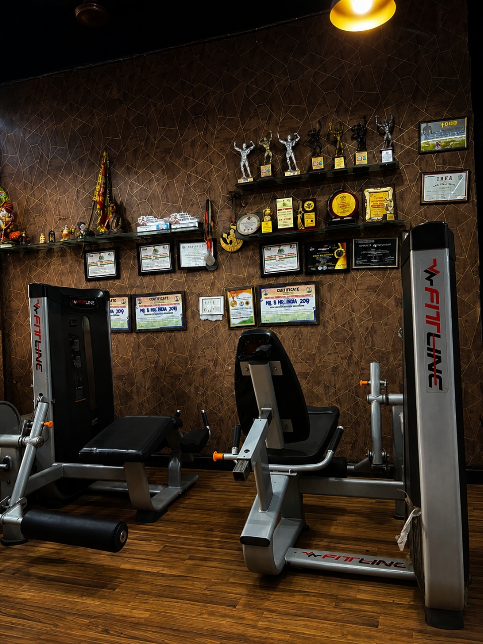 Trophy wall with strength machines