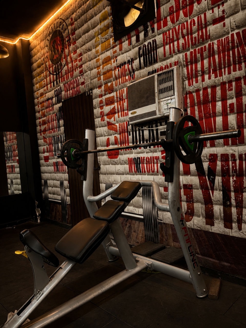 Incline bench against graffiti wall